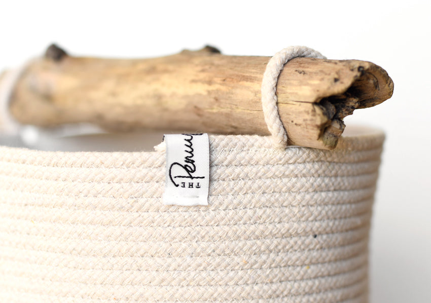 Tall rope basket with driftwood handle